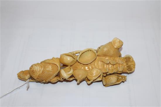 A Japanese ivory okimono of rats crawling over a lobster, early 20th century, unsigned 14.5cm